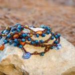 Teal orange brown beaded ve..