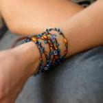 Teal orange brown beaded ve..