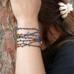 Teal orange brown beaded ve..