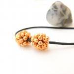 Golden pine-cones. Beaded b..