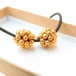 Golden pine-cones. Beaded b..